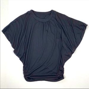New ladies Wing sleeved black tunic top. One size.